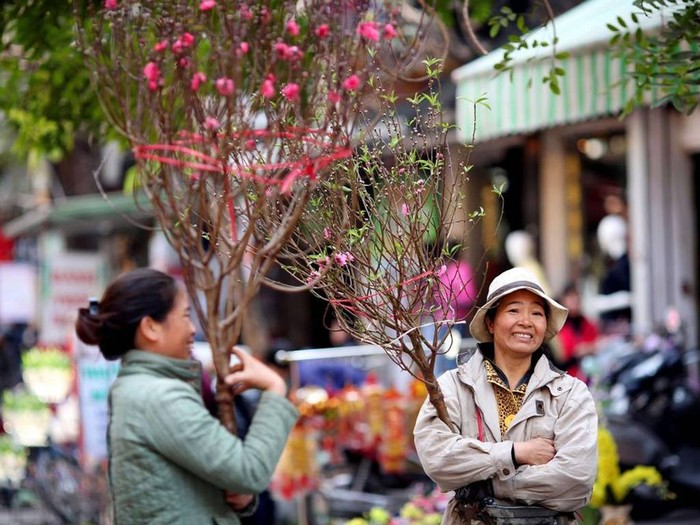 Người lao động sẽ được nghỉ Tết Nguyên đán từ 29 tháng Chạp đến mùng 5 tháng Giêng. Ảnh: EPA / Lương Thái Linh